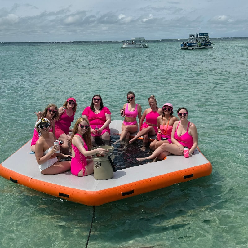 Bachelorette party on inflatable mat at Crab Island
