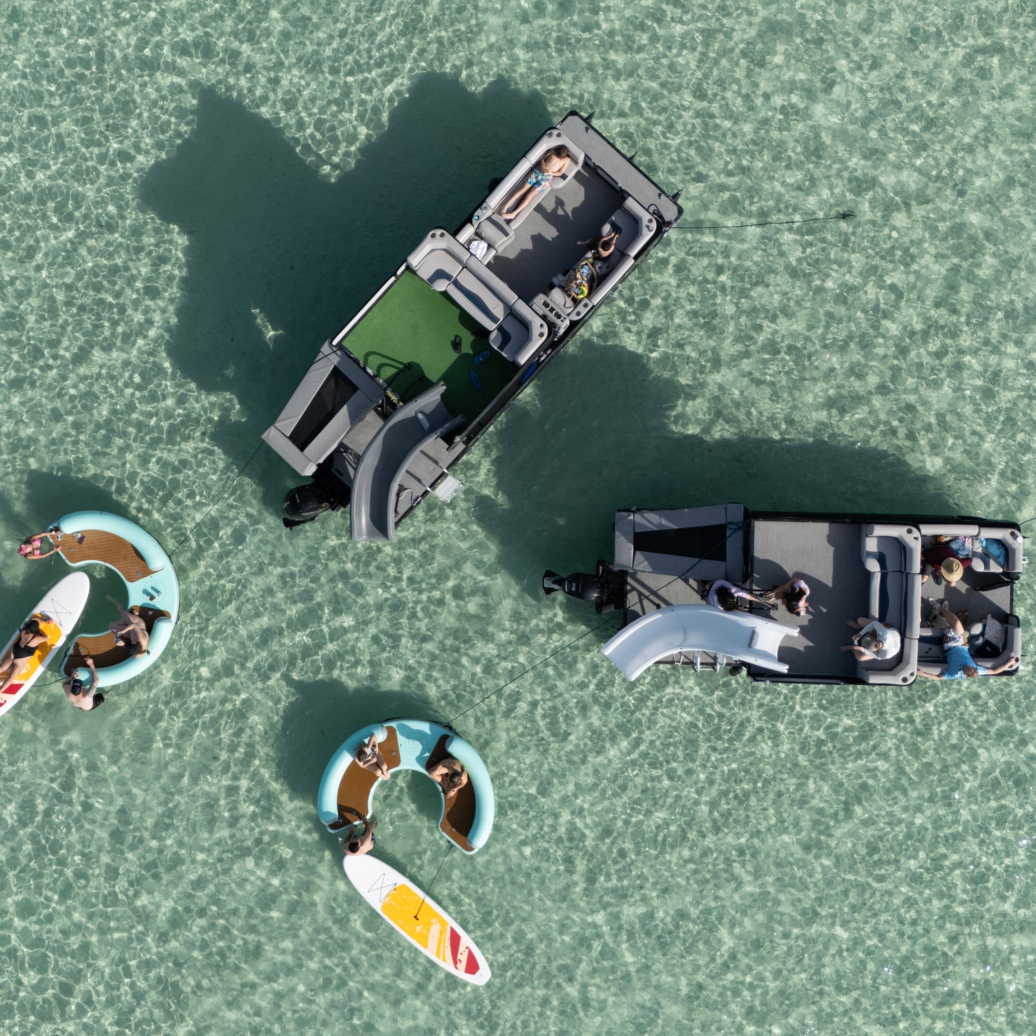 Aerial view of boat rental at Crab Island with inflatable mats and paddleboards